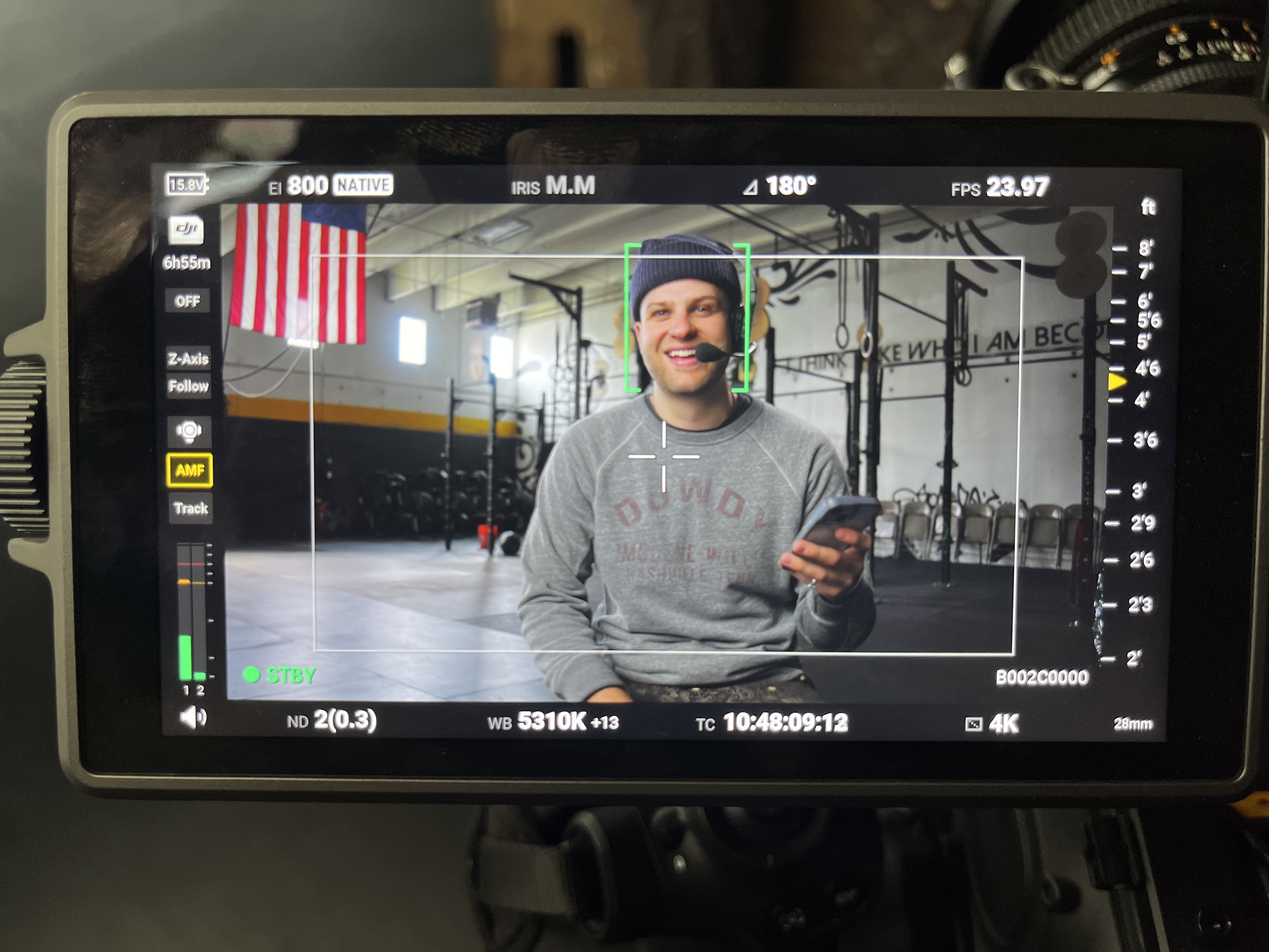 Connor Annand on set, camera monitor